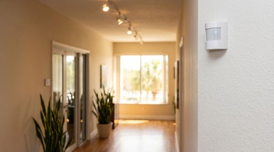 Commercial door sensor and motion detector in office hallway